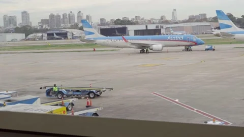 Aircrafts And Work Vehicles On The Platform in Airport  Buenos Aires4K 動画素材 201877858