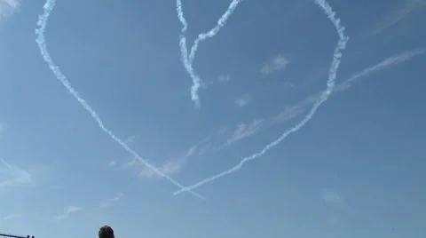 Aircrafts Paint A Heart And Arrow In The Sky Stock Footage