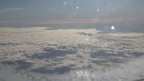 Aircraft's window above dense clouds on sunny day 動画素材 127874661
