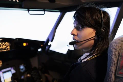 Aircrew copilot using power radar on dashboard to fly aircraft jet Foto stock