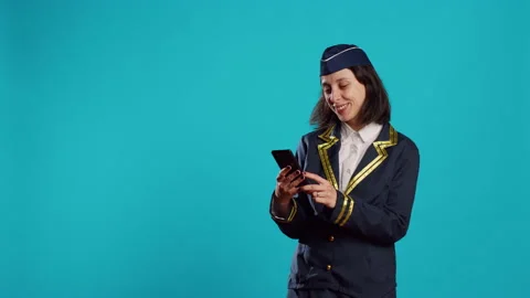 Aircrew member browsing online website on camera 스톡 동영상 233644588