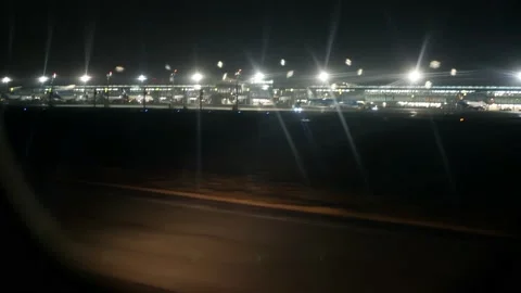 Airfield lights. The plane accelerates along the runway of the airport  Stock Footage 154272864