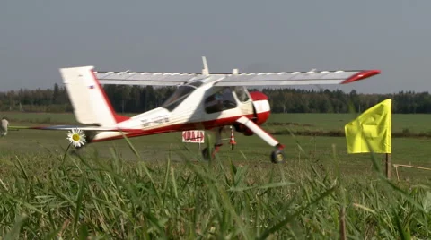 Airfield in summer. Single-engine plane on runway Stock Footage 57652120