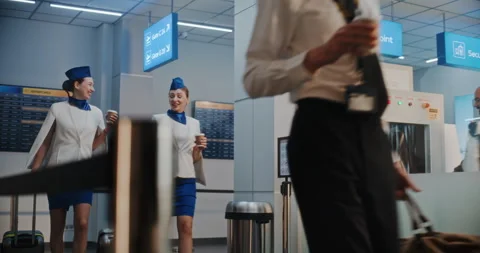 Airline Captain and Two Stewardesses Walking for Flight, Passing by Security Stock Footage 306078049