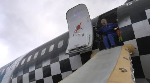 Airline crew training to use emergency exit slde Stock Footage 55576400