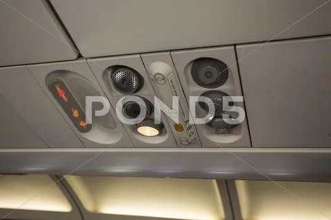 Airline passenger cabin overhead vent light Stock Photos