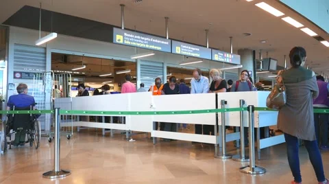 Airline passengers checking in at the security line in an Airport. Stock Footage 62772748