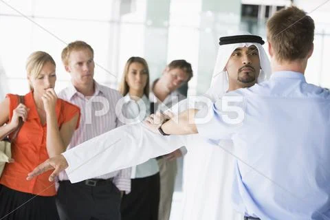 Airline passengers undergoing a security check Stock Photos