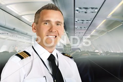Airline pilot on board Stock Photos