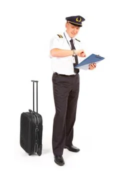Airline pilot checking time Stock Photos