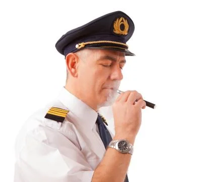Airline pilot with cigarette Stock Photos