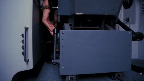 Airline Pilot Setting Seat Position Using Lever in Cockpit Stock-Footage 326180251
