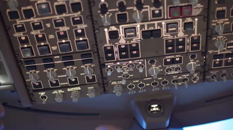 Airline pilot switching controls on overhead panel in a 747 cockpit 4K Stock Footage 53127859