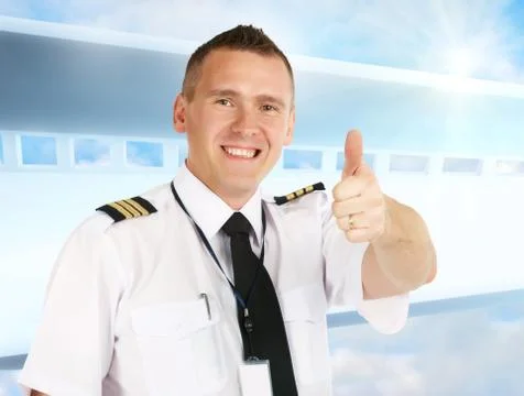 Airline pilot thumb up Stock Photos