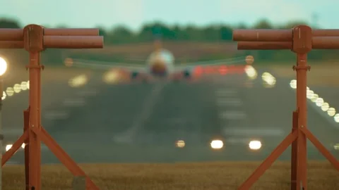 Airliner accelerating on runway framed by glide slope masts. Jet rolling fast Stock Footage 328358197