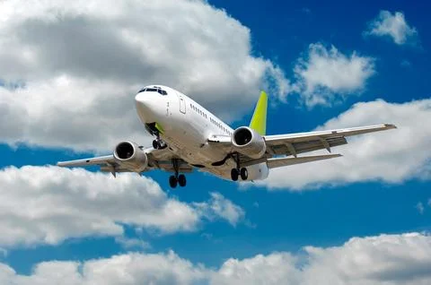 Airliner and clouds Stock Photos
