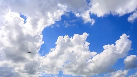 Airliner flies at the background of blue cloudy sky. Stock Footage 75959238