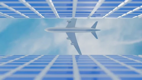 An airliner flies into the gap between two skyscrapers on a blue sky with white  Stock Footage 241469921
