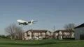 Airliner flies low over houses HD Footage