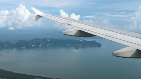 Airliner flies over the ocean Stock Footage 166403731