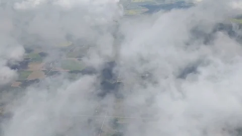 Airliner Flying through Clouds Stock Footage 78604113