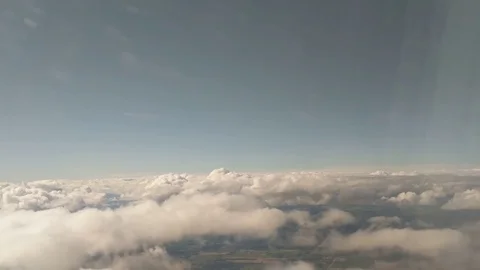Airliner Flying through Clouds Stock Footage 78604945