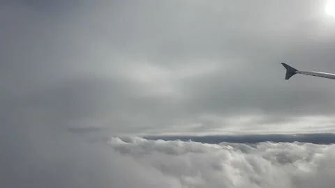 Airliner flying into two layers of clouds Stock Footage 224937324