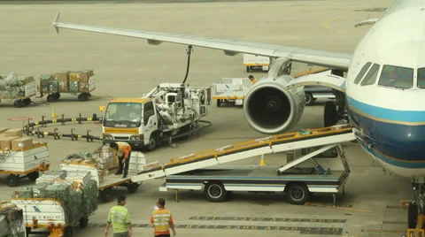 Airliner at gate loading and refueling in Shenzhen Baoan Airport Stock Footage 27267956