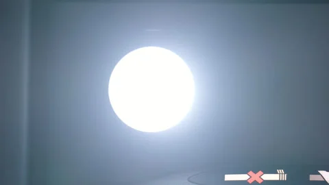 Airliner reading light lamp turning on and off, close-up low angle shot Stock Footage 327654824