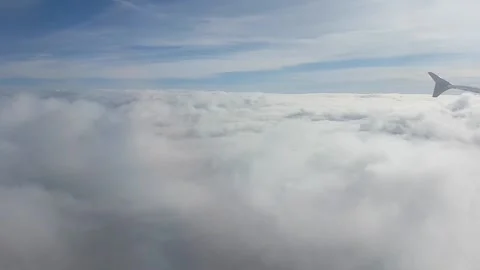 Airliner surfing on clouds Stock Footage 224931780