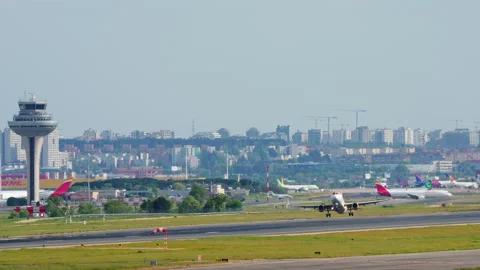 Airliner taking off with Madrid Barajas control tower in background Stock Footage 334513349
