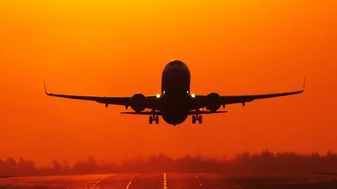 Airliner taking off at sunrise Stock Footage 106307634