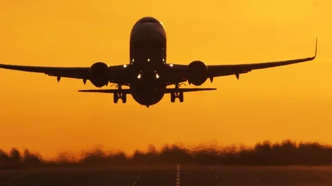Airliner taking off at sunrise Stock Footage 106307659