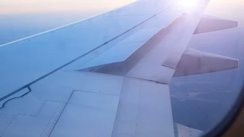 Airliner wing raises flaps to prepare for landing Video stock 107035783