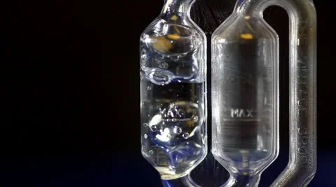 Airlock bubbles from fermenting beer 03 Stock Footage 24827625