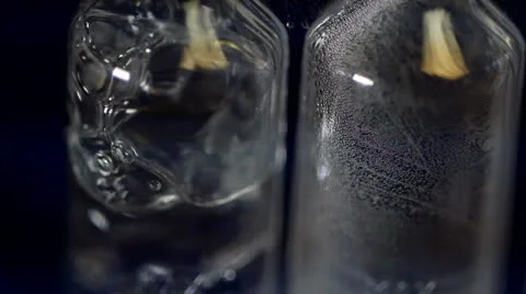 Airlock bubbles from fermenting beer 05 Stock Footage 24827651