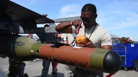 Airman checking electrical current of weapon during building and loading program Stock Footage 83308725