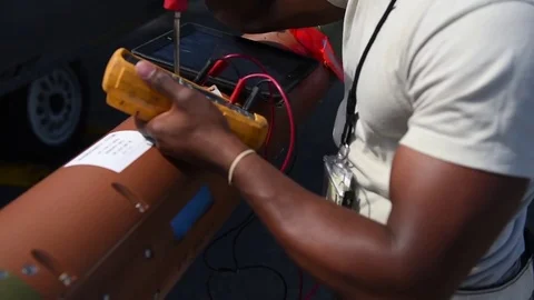Airman checking electrical current of weapon during building and loading program Stock Footage 83308738