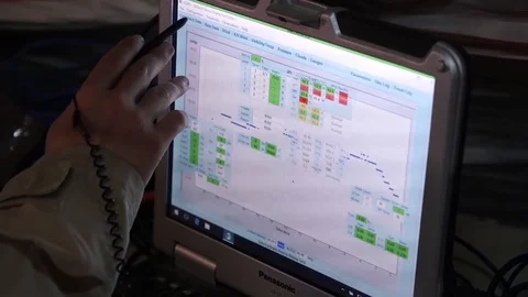 Airman collecting data off computer from weather station Vídeos de archivo 86857551