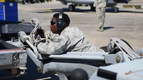 Airman positioning bomb loader during munitions building and loading program Stock Footage 83308785