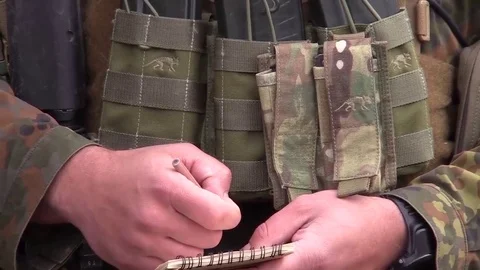 Airman taking notes during Close Air Support Training with US and German airmen Stock Footage 83646234