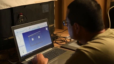 Airman using building design software on laptop computer 動画素材 111811604