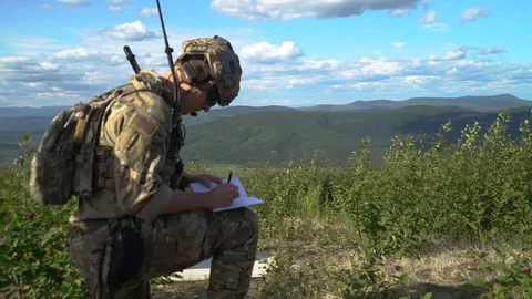 Airman writing in notebook during close air support exercise for Red Flag Alaska Vídeos de archivo 110732374