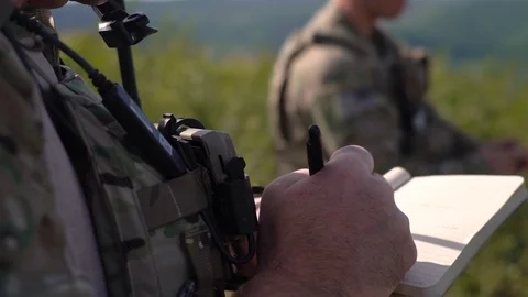 Airman writing in notebook during close air support exercise for Red Flag Stock Footage 110732588