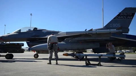 Airmen assembling weapons in fighter Aircraft for Evaluation - 2017 Stock Footage 84730426