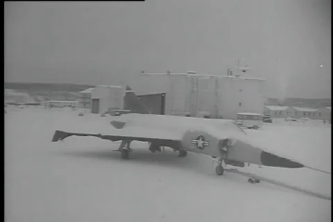 Airmen clean and remove snow formed on Delta Wing F-102 and F-101 - 1956 Stock Footage 99086032
