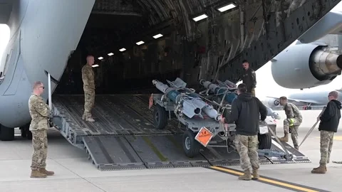 Airmen loading munitions onto C-17 Globemaster aircraft Stock Footage 273292805