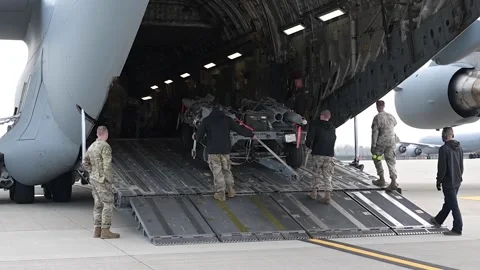 Airmen loading ordnance onto C-17 Globemaster aircraft Stock Footage 273292927