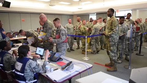 Airmen queue while while waiting to be processed for deployment Stock Footage 91381364