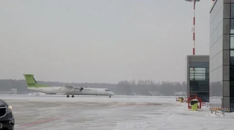 Airplain moving to runway in winter Stock Footage 60127489